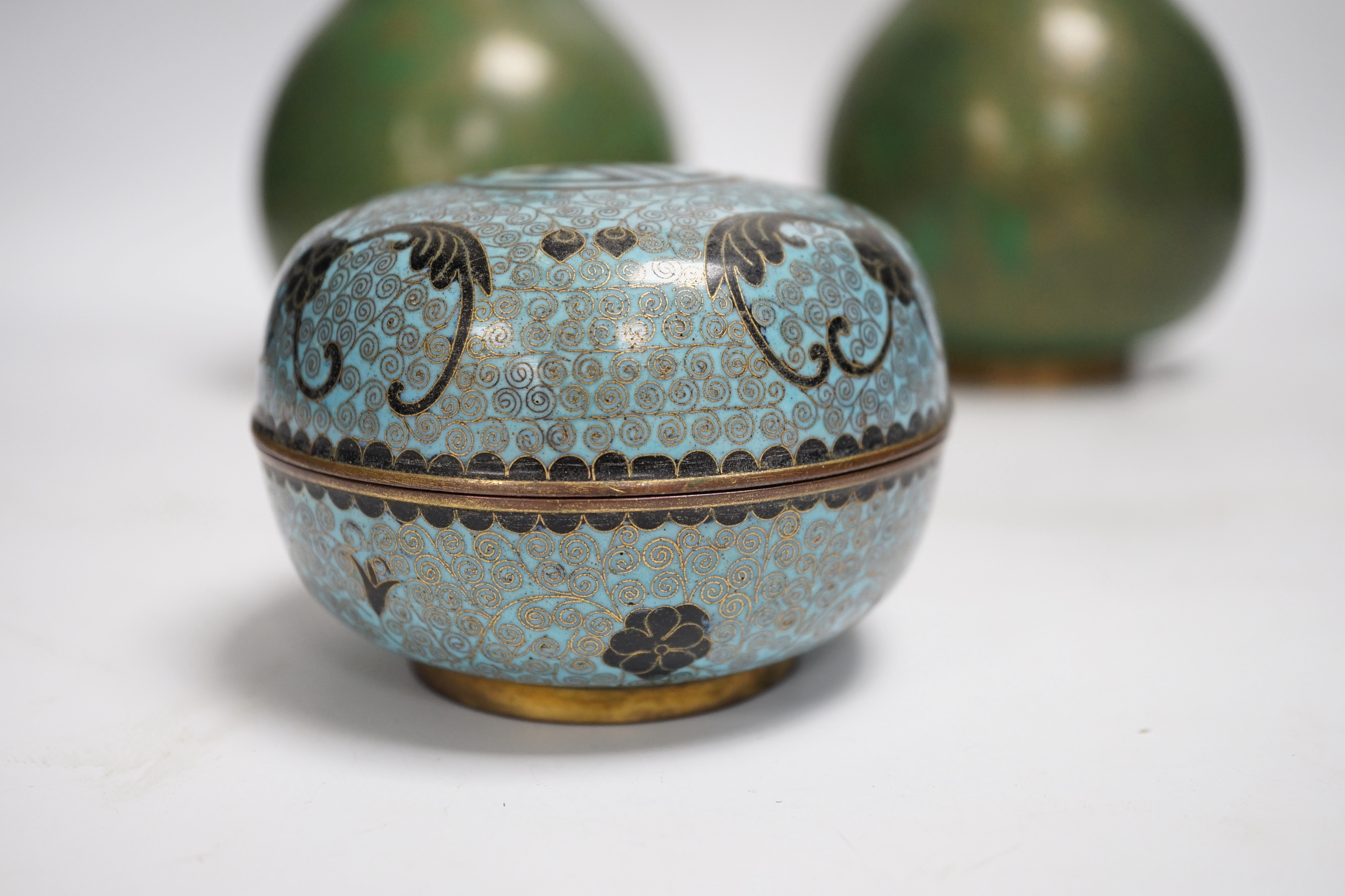 A pair of Chinese cloisonne enamel vases and a box and cover, tallest 23cm